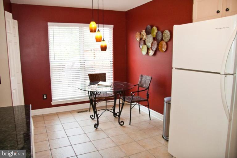 4440 Cole Farm Road Nottingham, MD 21236 - Photo 11 of 26 a view of kitchen with furniture and refrigerator