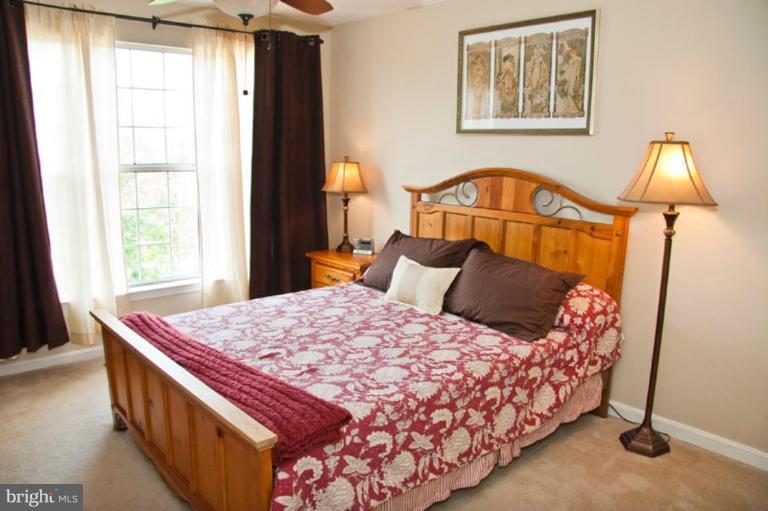 4440 Cole Farm Road Nottingham, MD 21236 - Photo 18 of 26 a bedroom with a bed and a window