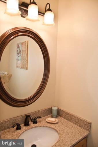 4440 Cole Farm Road Nottingham, MD 21236 - Photo 25 of 26 a bathroom with a sink and mirror