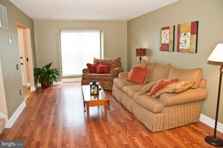 4440 Cole Farm Road Nottingham, MD 21236 - Photo 6 of 26 a living room with furniture and wooden floor