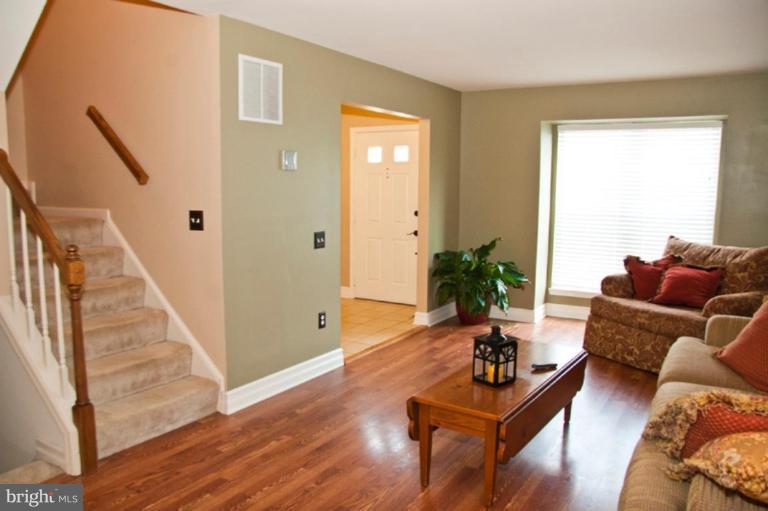 4440 Cole Farm Road Nottingham, MD 21236 - Photo 7 of 26 a living room with furniture and a wooden floor
