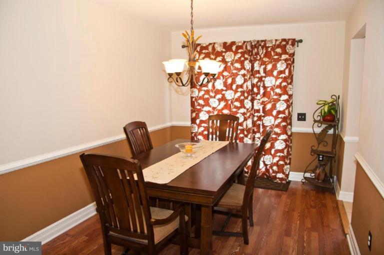 4440 Cole Farm Road Nottingham, MD 21236 - Photo 8 of 26 a view of a dining room with furniture and wooden floor