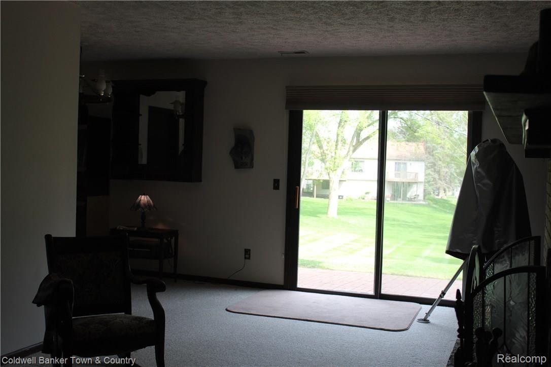 11882 Knob Hill Road Brighton, MI 48114 - Photo 29 of 41 Finished walkout basement with a daylight window