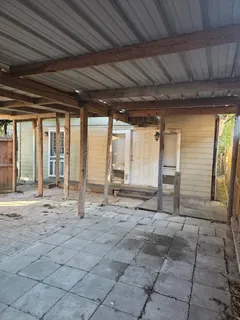 a view of a room with wooden walls