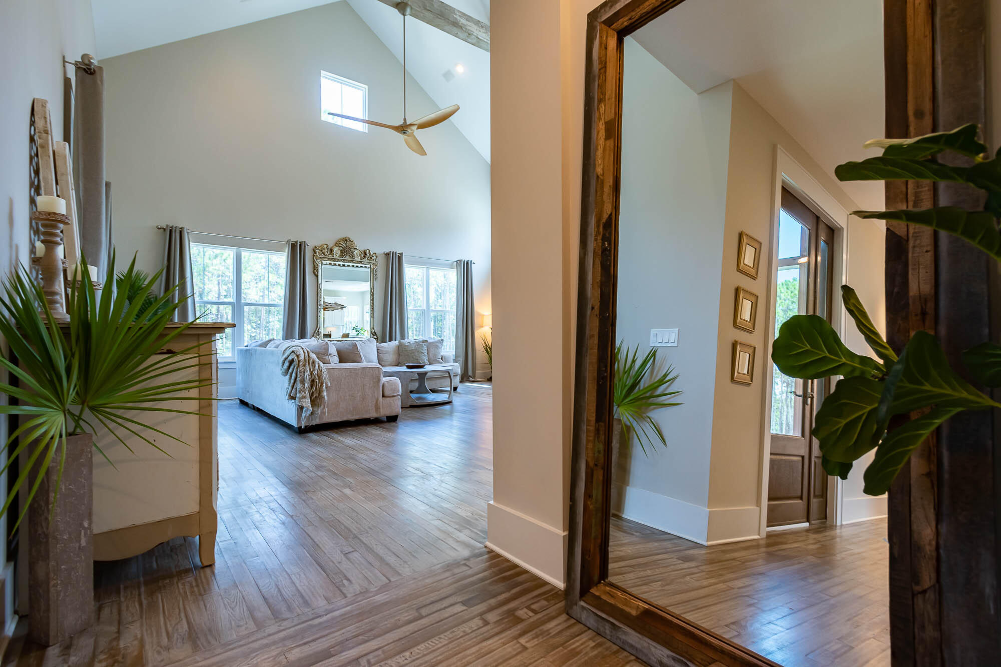 770 North Church Street Santa Rosa Beach, FL 32459 - Photo 11 of 85 a living room with furniture floor to ceiling window and wooden floor