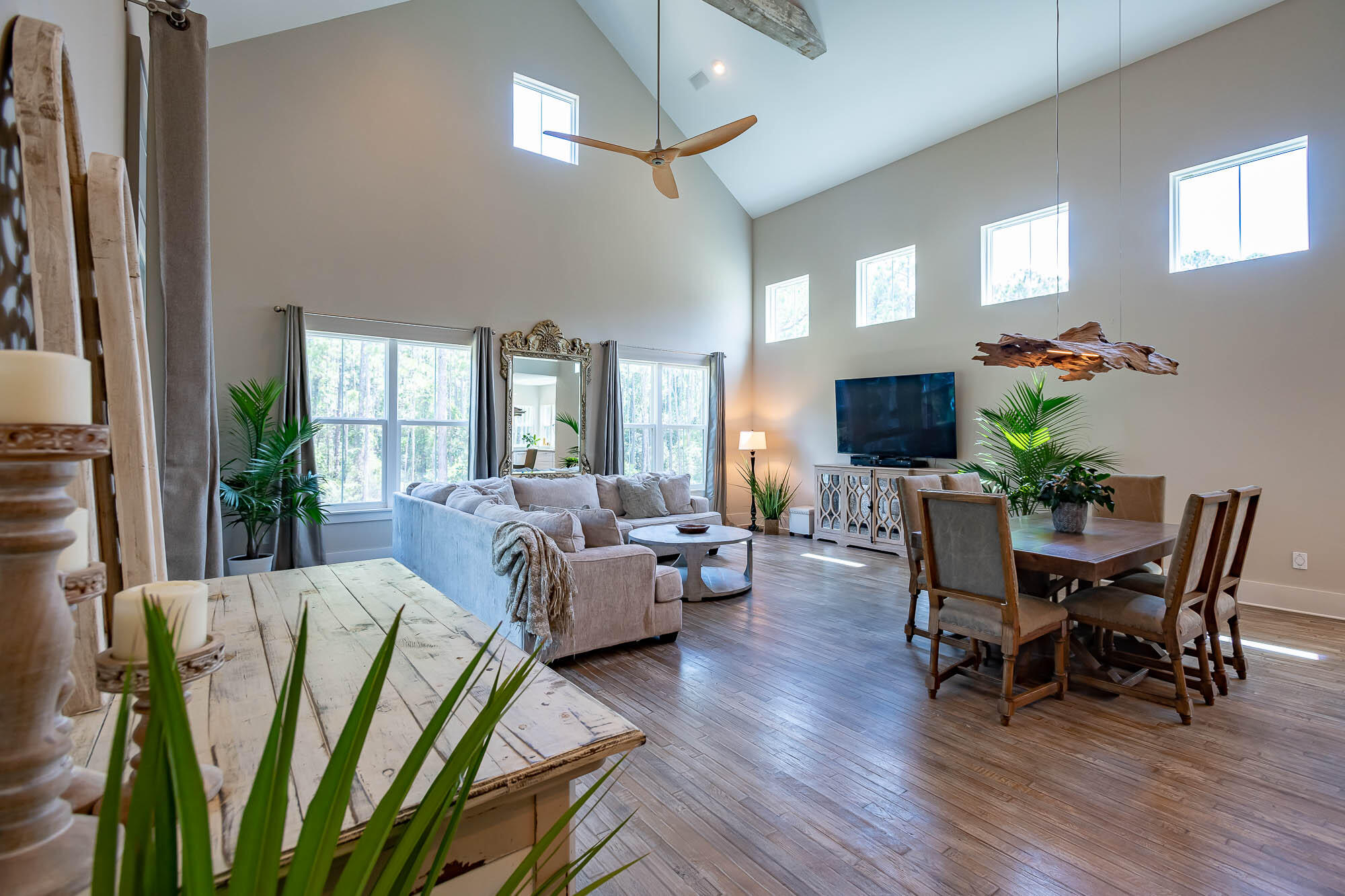770 North Church Street Santa Rosa Beach, FL 32459 - Photo 12 of 85 a living room with furniture dining area and a flat screen tv