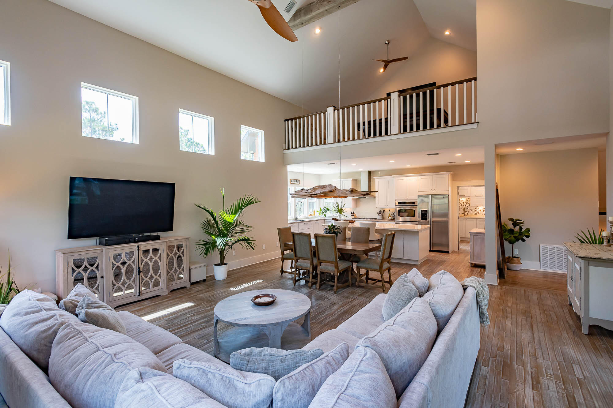 770 North Church Street Santa Rosa Beach, FL 32459 - Photo 15 of 85 a living room with furniture and a flat screen tv
