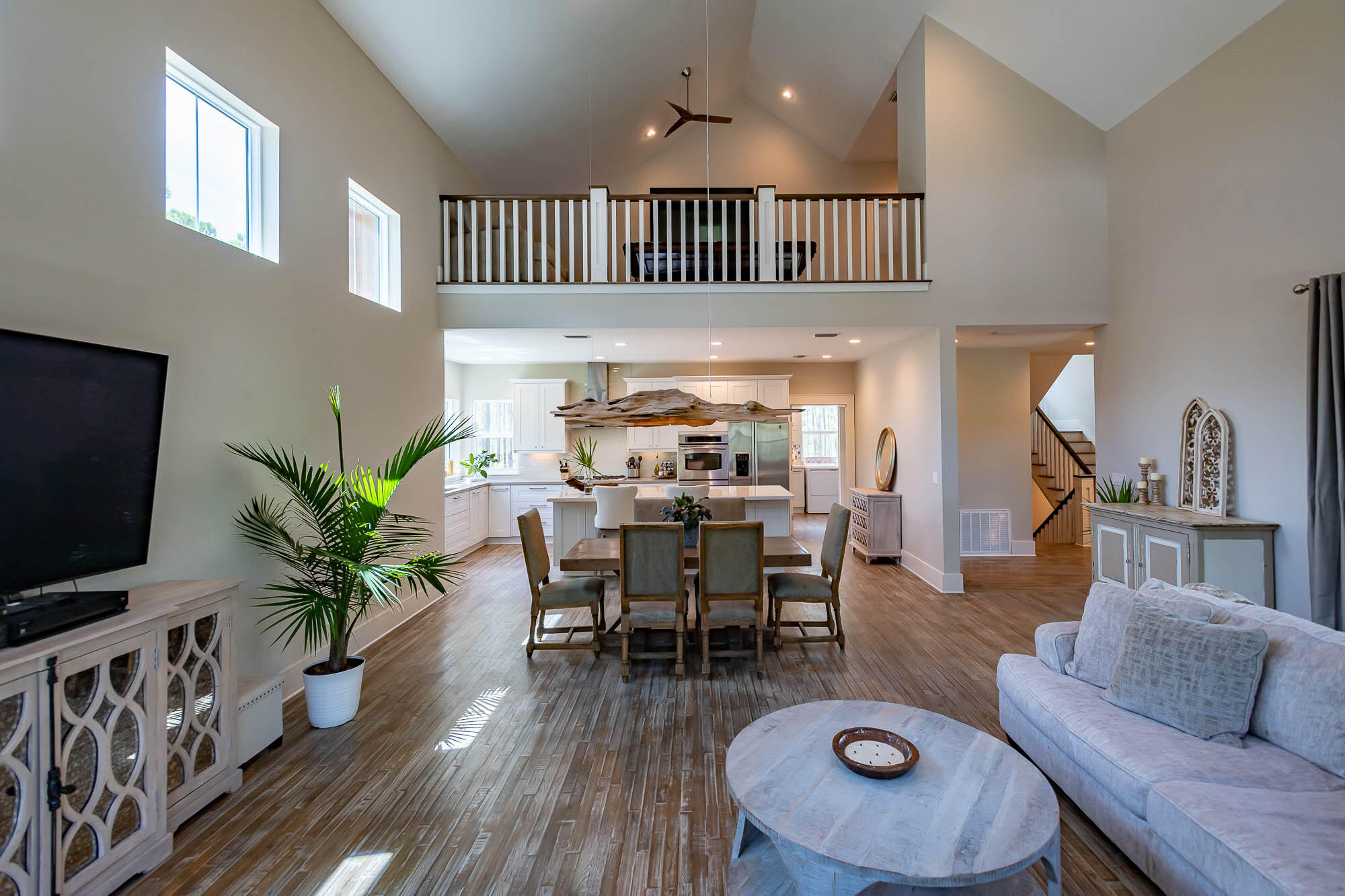 770 North Church Street Santa Rosa Beach, FL 32459 - Photo 17 of 85 a living room with furniture or wooden floor and a flat screen tv