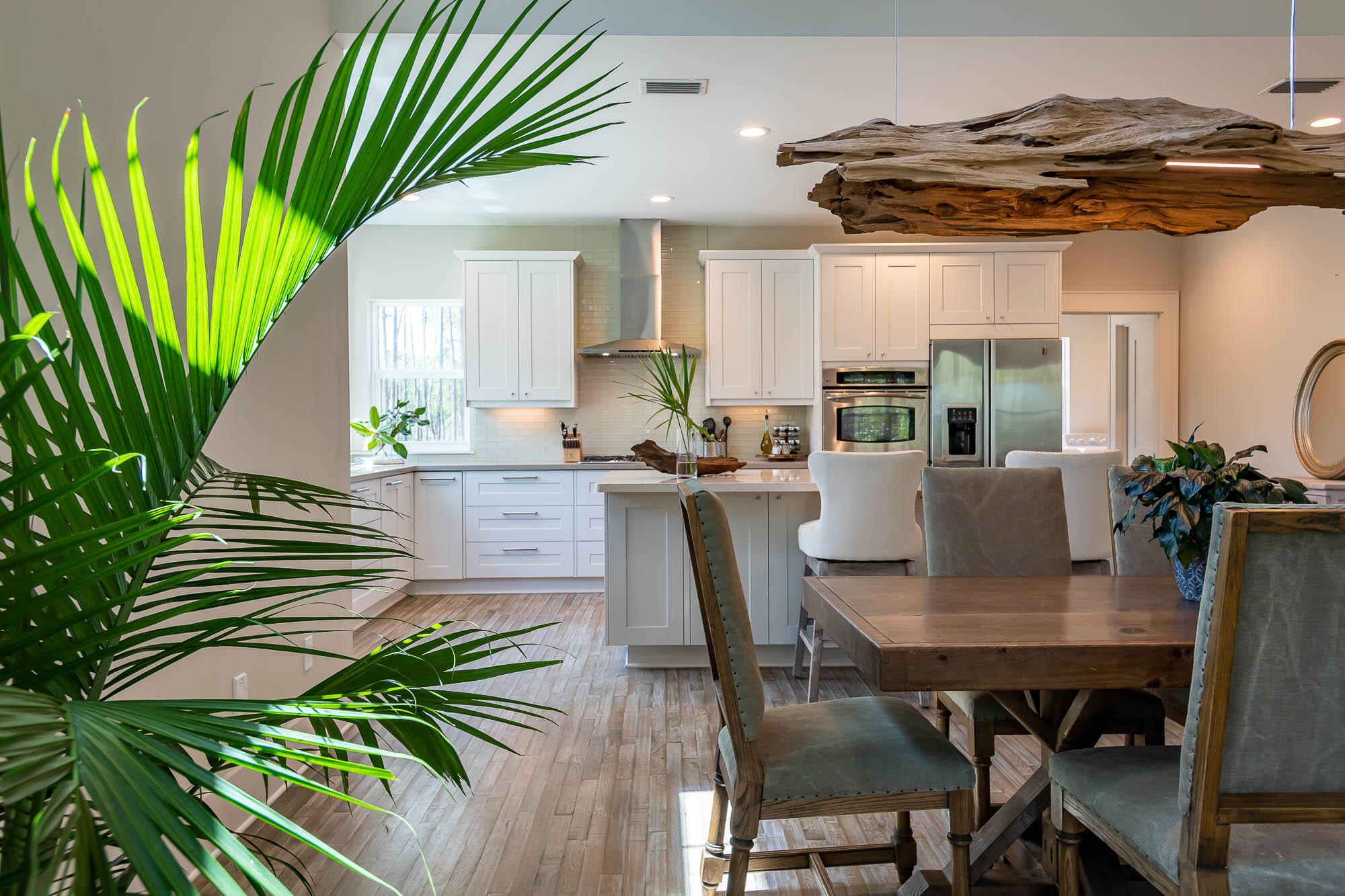 770 North Church Street Santa Rosa Beach, FL 32459 - Photo 24 of 85 a view of a dining room with furniture and a potted plant