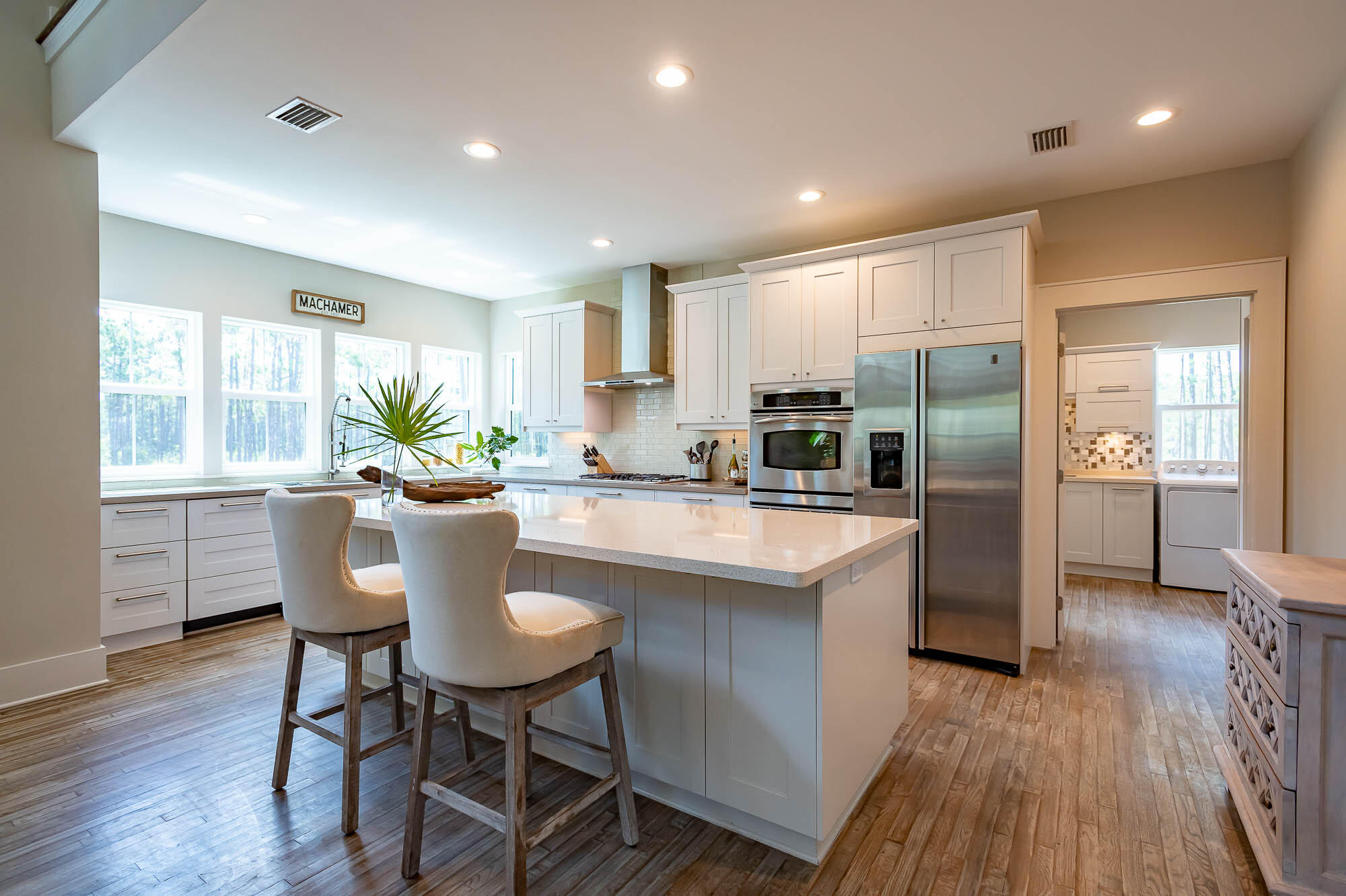 770 North Church Street Santa Rosa Beach, FL 32459 - Photo 25 of 85 a kitchen with kitchen island a counter top space a sink stainless steel appliances and cabinets