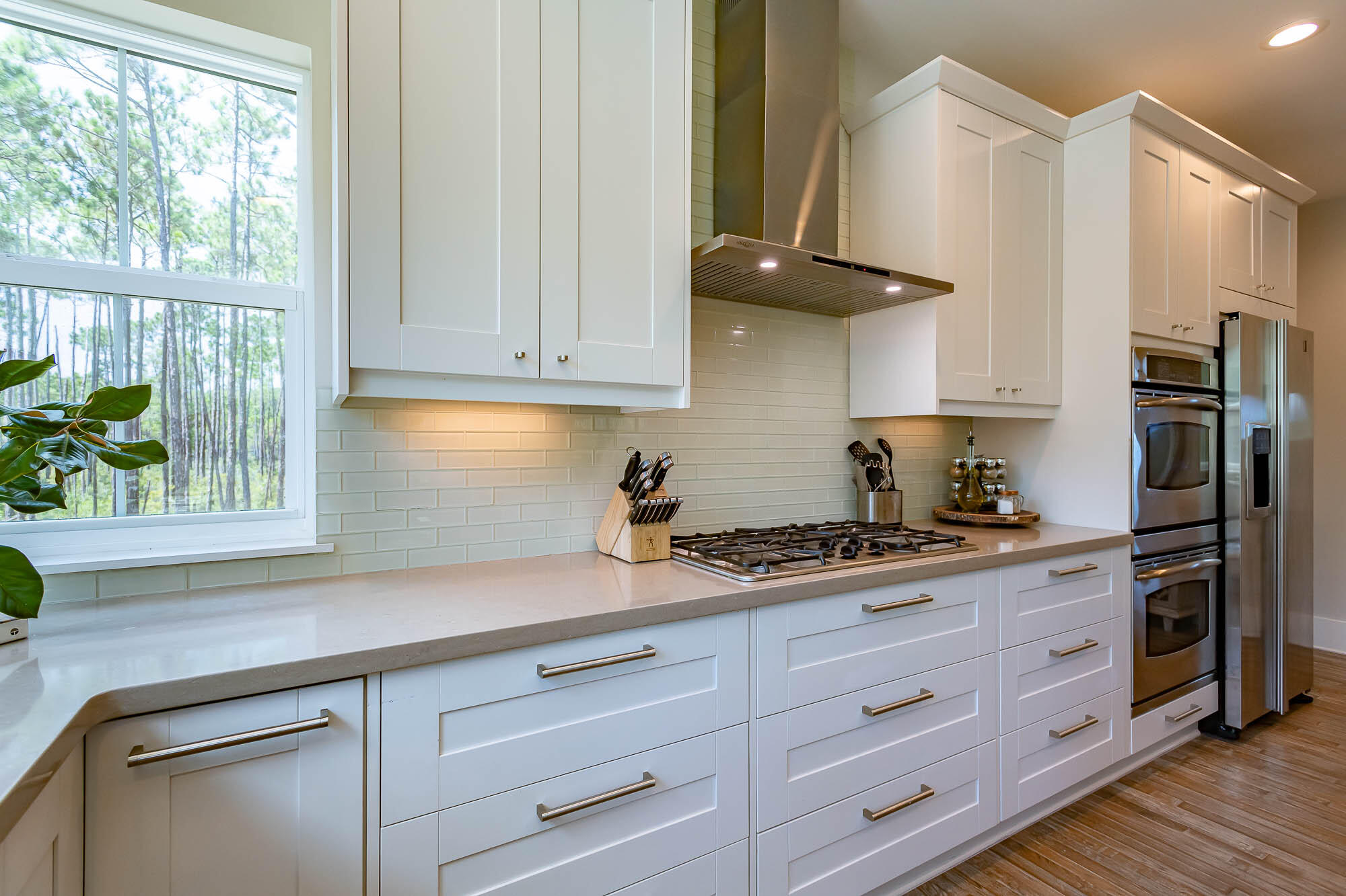 770 North Church Street Santa Rosa Beach, FL 32459 - Photo 29 of 85 a kitchen with stainless steel appliances granite countertop a sink a stove and a refrigerator