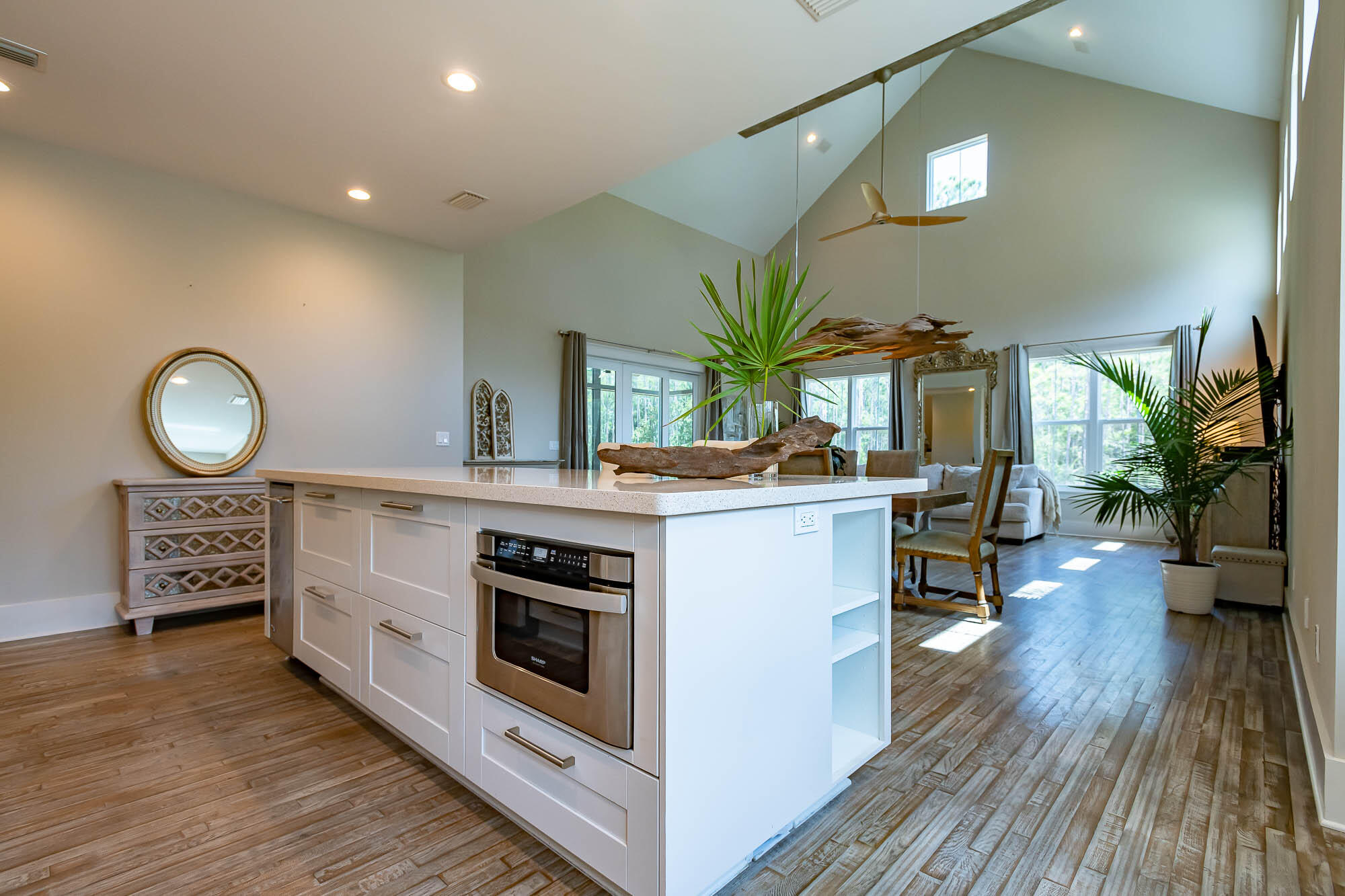 770 North Church Street Santa Rosa Beach, FL 32459 - Photo 30 of 85 a kitchen that has a lot of cabinets a sink and a stove with wooden floor