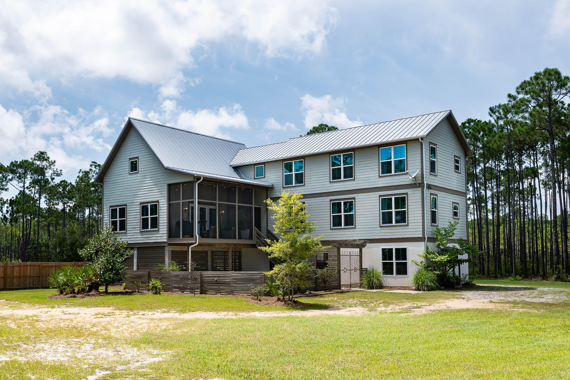 770 North Church Street Santa Rosa Beach, FL 32459 - Photo 3 of 85 a view of a house with a swimming pool and a yard