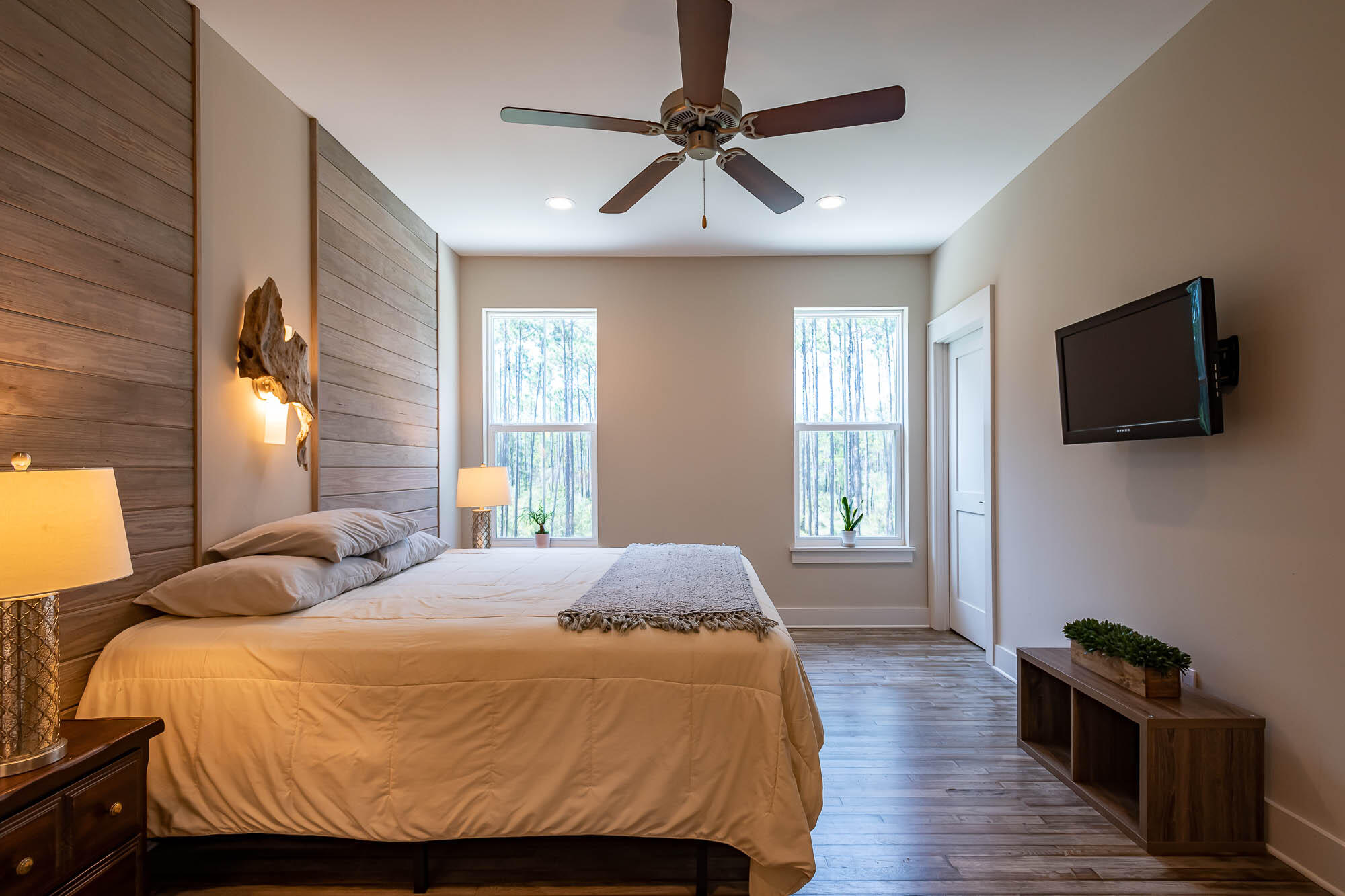 770 North Church Street Santa Rosa Beach, FL 32459 - Photo 41 of 85 a bedroom with a bed and wooden floor