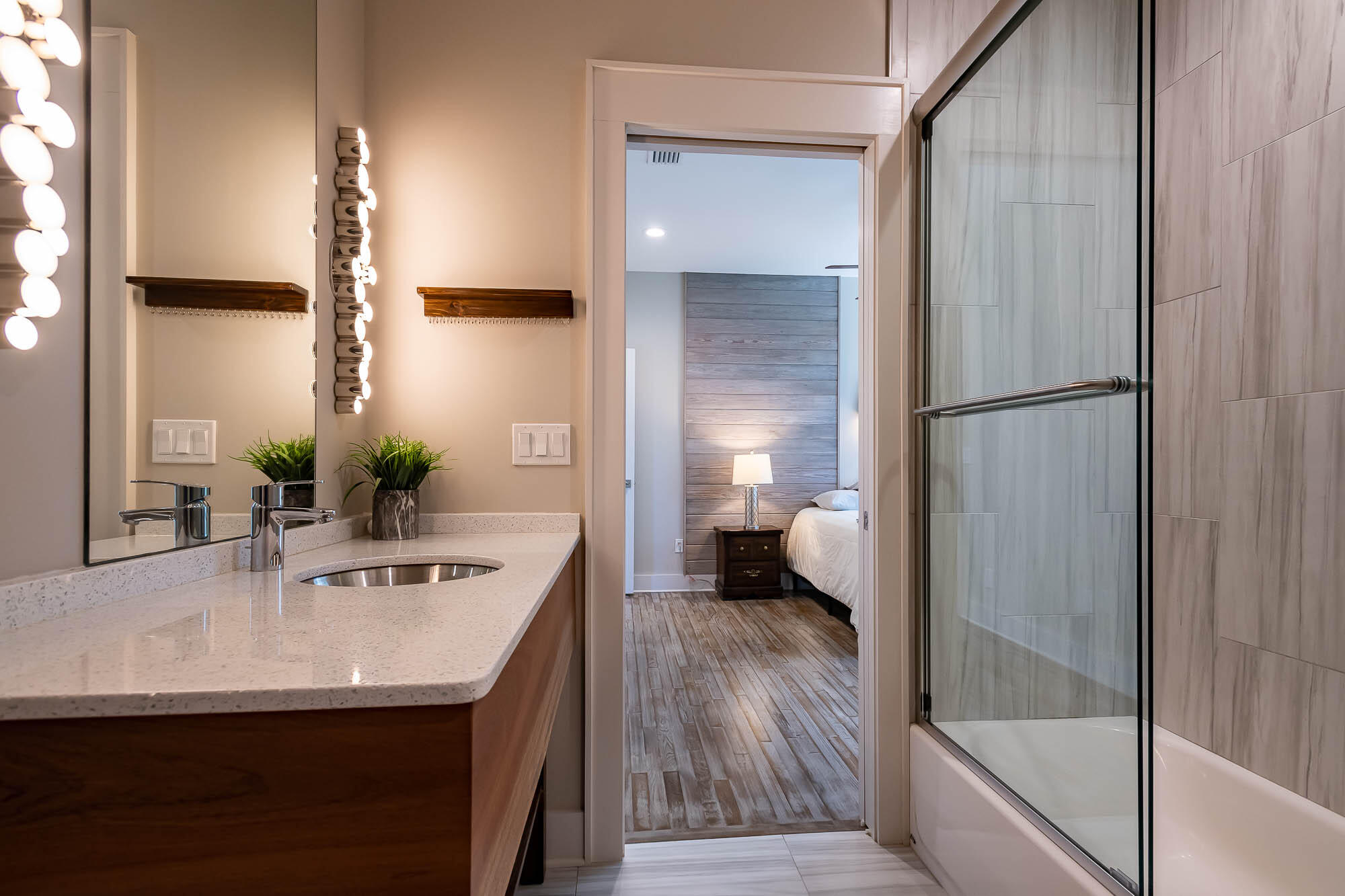770 North Church Street Santa Rosa Beach, FL 32459 - Photo 42 of 85 a bathroom with a sink a mirror and a shower