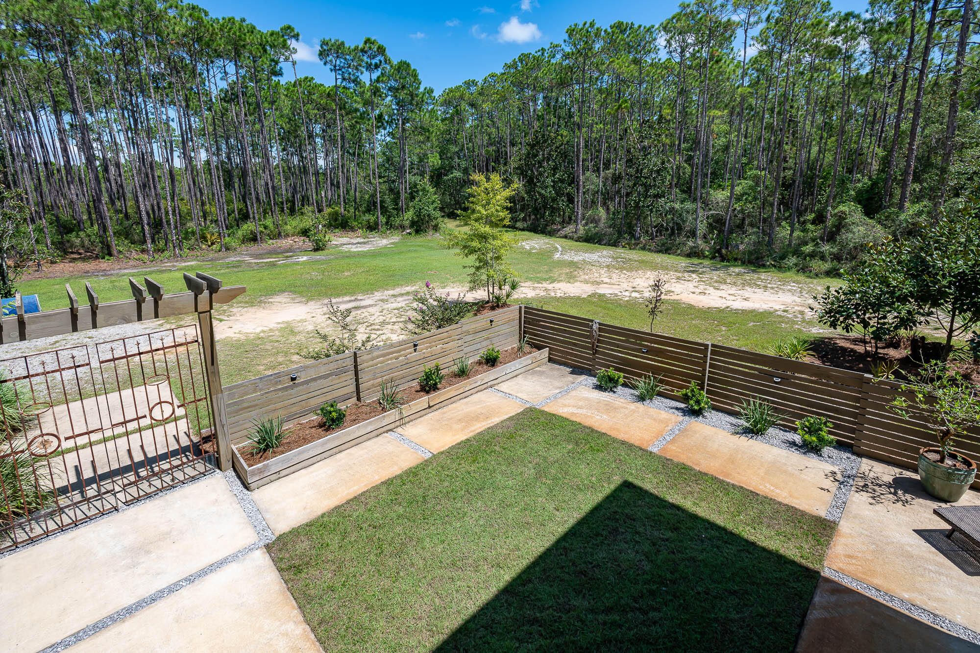 770 North Church Street Santa Rosa Beach, FL 32459 - Photo 5 of 85 a view of a backyard with a sitting area