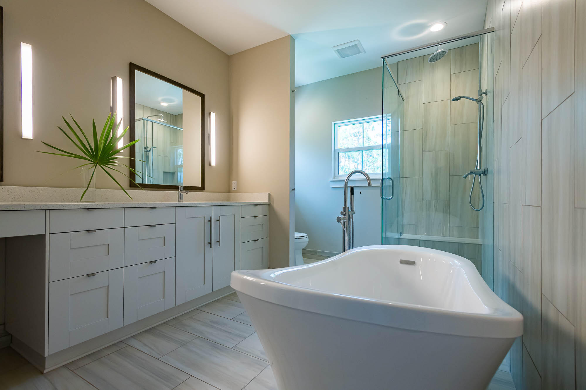 770 North Church Street Santa Rosa Beach, FL 32459 - Photo 62 of 85 a bathroom with a bathtub a mirror a sink and vanity