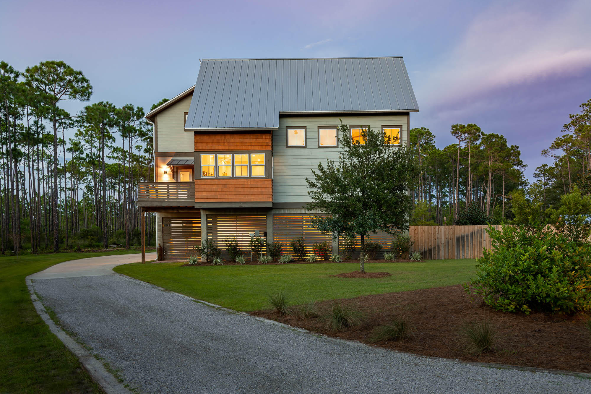770 North Church Street Santa Rosa Beach, FL 32459 - Photo 77 of 85 a front view of a house with a yard and trees