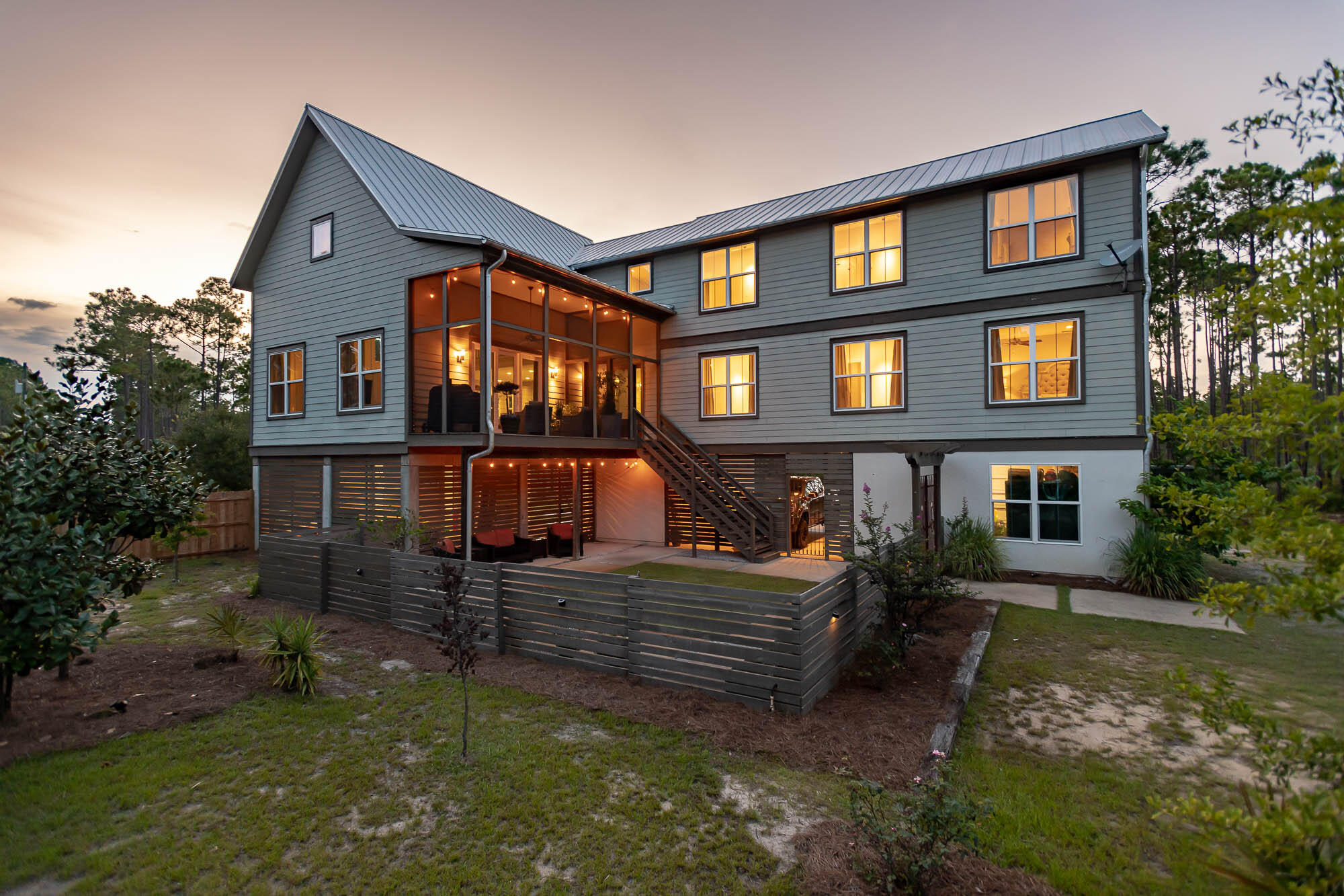 770 North Church Street Santa Rosa Beach, FL 32459 - Photo 80 of 85 a front view of a house with garden
