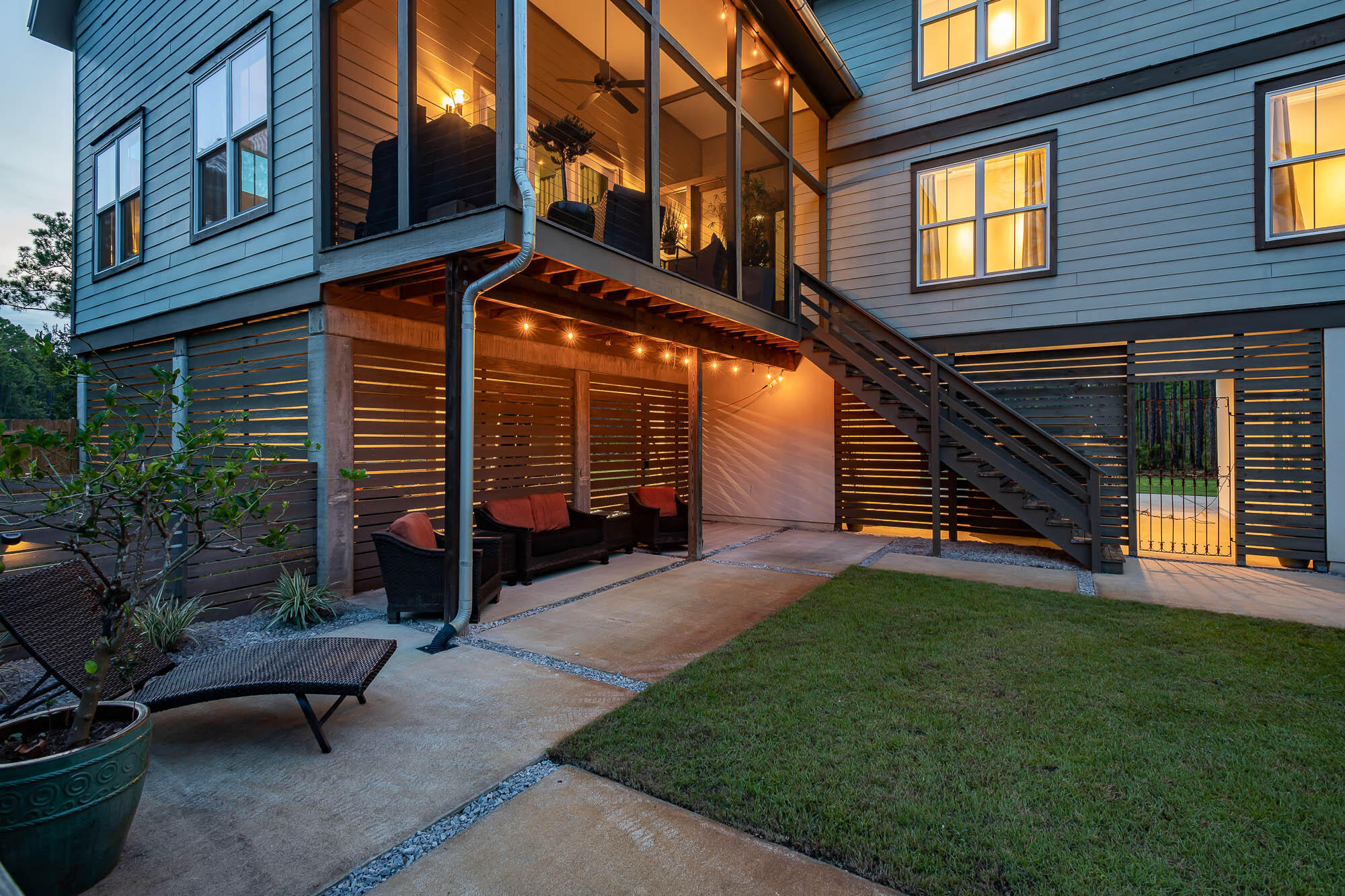 770 North Church Street Santa Rosa Beach, FL 32459 - Photo 81 of 85 a view of a patio with a table and chairs and potted plants