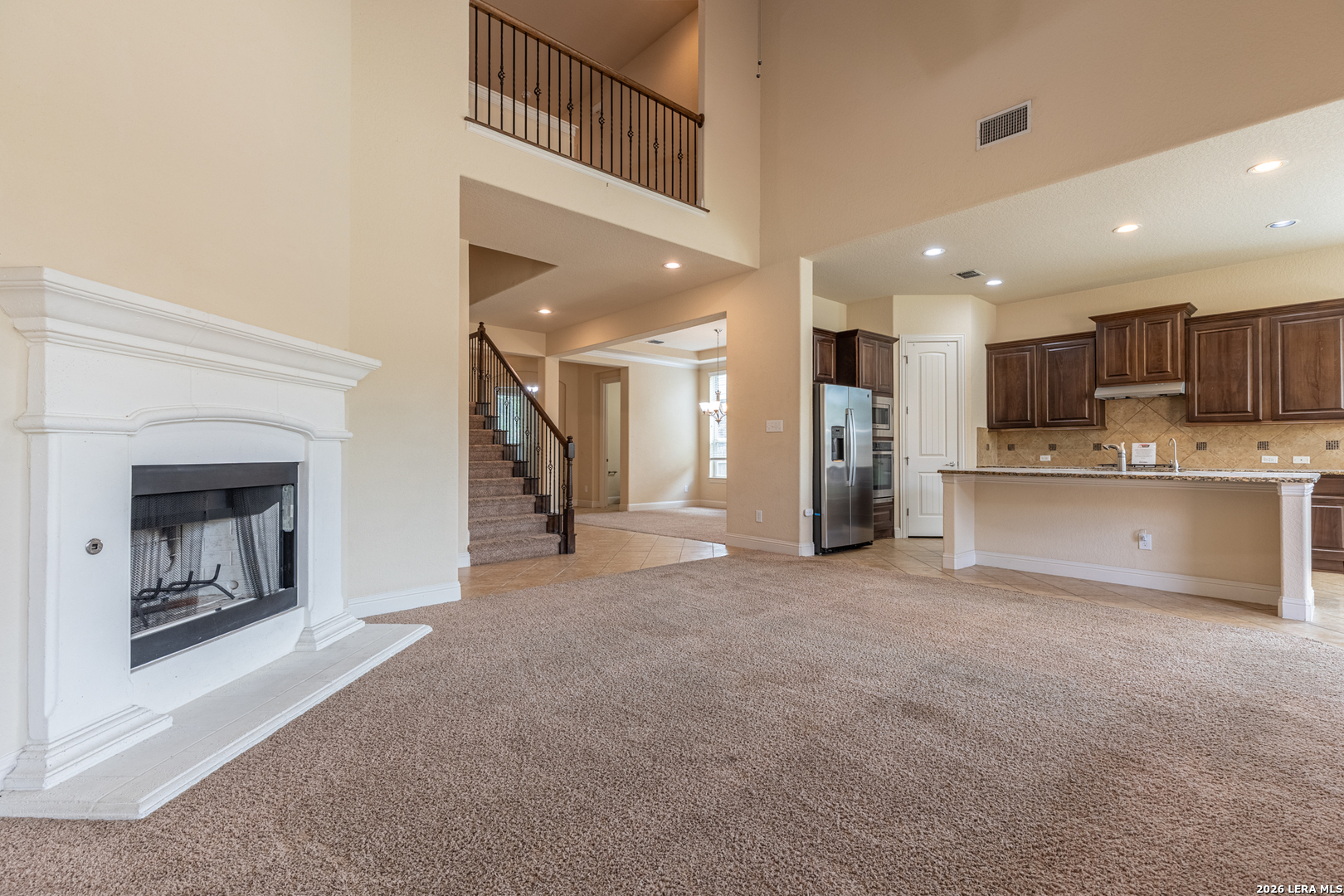 8103 Mystic Chase Boerne, TX 78015 - Photo 12 of 49 a view of a kitchen with a sink and a refrigerator