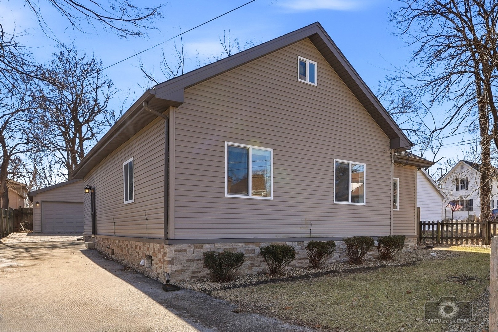 a front view of a house with trees