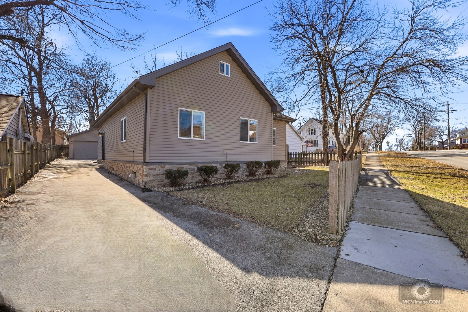 417 Thornton Street Lockport, IL 60441 - Photo 4 of 33 a front view of a house with trees and yard