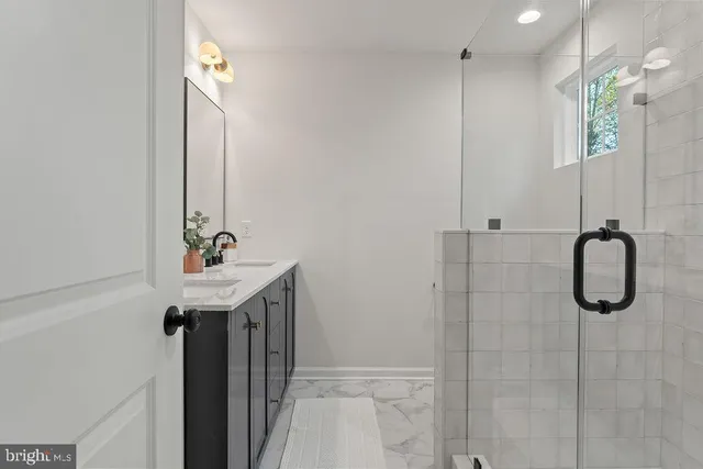 a bathroom with a bathtub and window