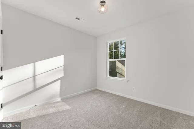 an aerial view of lake residential houses with outdoor space and trees