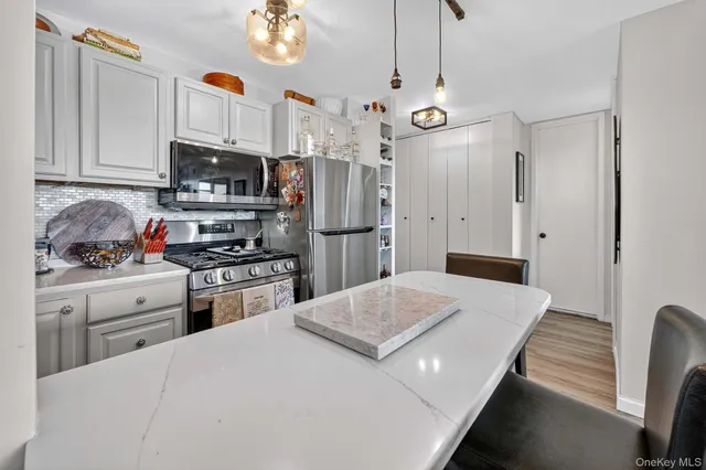 a view of living room with granite countertop furniture and fireplace
