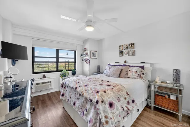 a bedroom with a large bed and a window