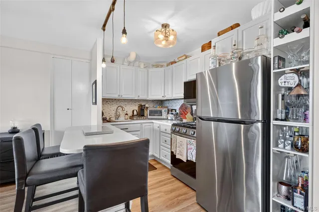 a spacious bathroom with a granite countertop sink and mirror
