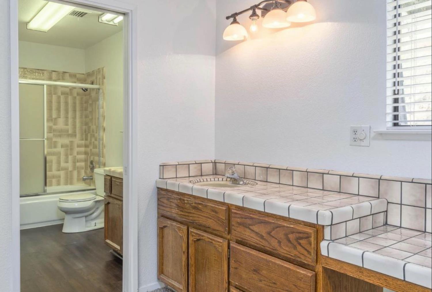 27817 Sky Harbour Road Friant, CA 93626 - Photo 18 of 36 a bathroom with a sink and a toilet