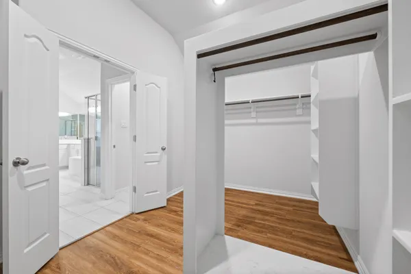 a view of room with wooden floor