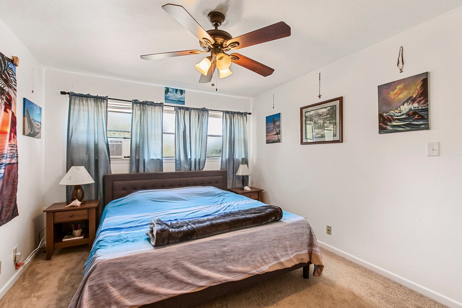 6029 Old Fredericksburg Road, Unit A Austin, TX 78749 - Photo 7 of 20 a bedroom with a bed and a chandelier