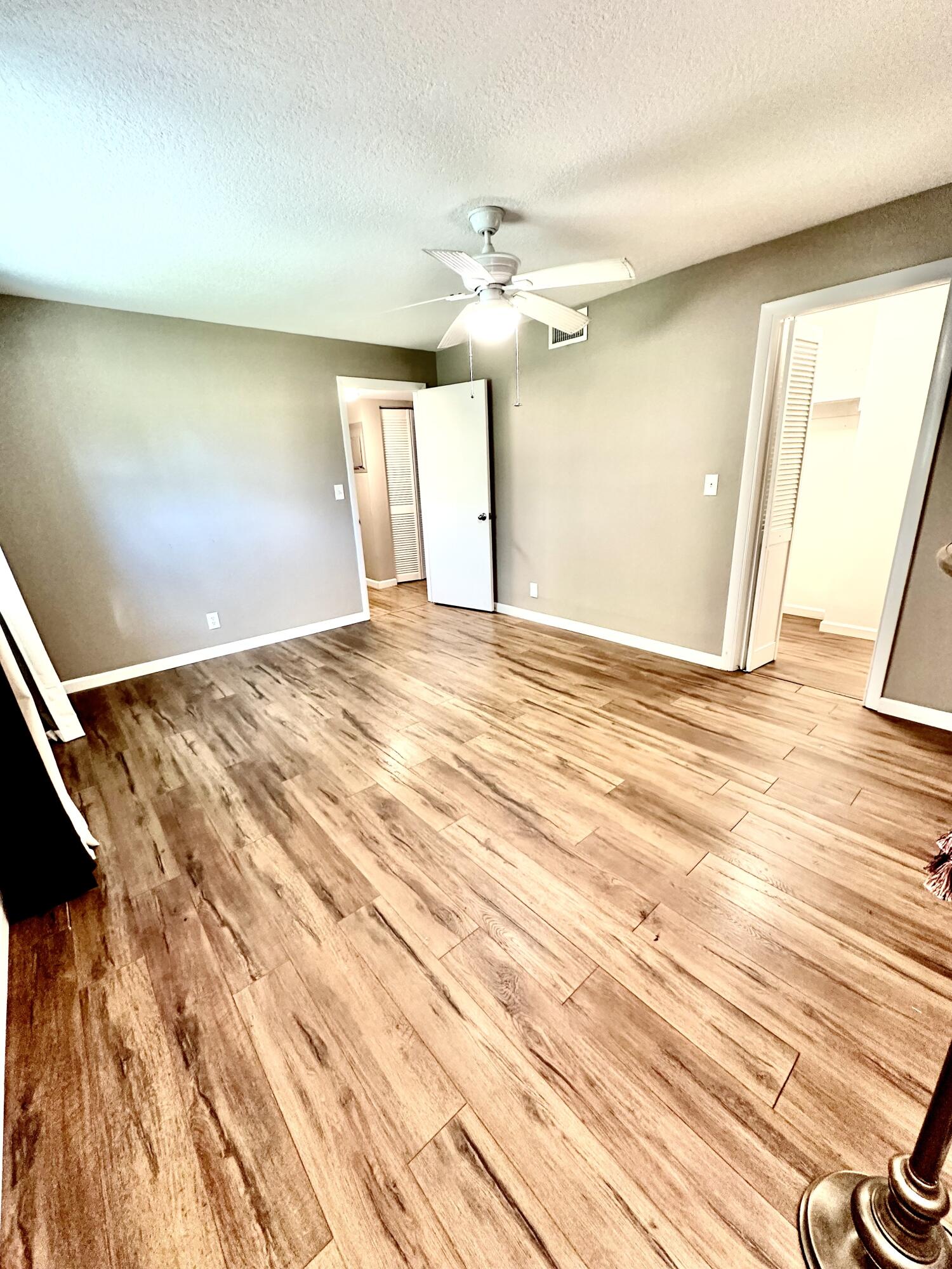 10821 North Military Trail, Unit 21 Palm Beach Gardens, FL 33410 - Photo 24 of 34 a view of a livingroom with wooden floor