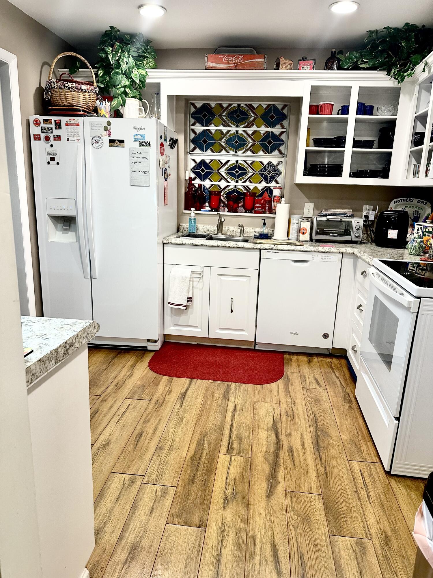 10821 North Military Trail, Unit 21 Palm Beach Gardens, FL 33410 - Photo 9 of 34 a kitchen with stainless steel appliances granite countertop a refrigerator and a stove