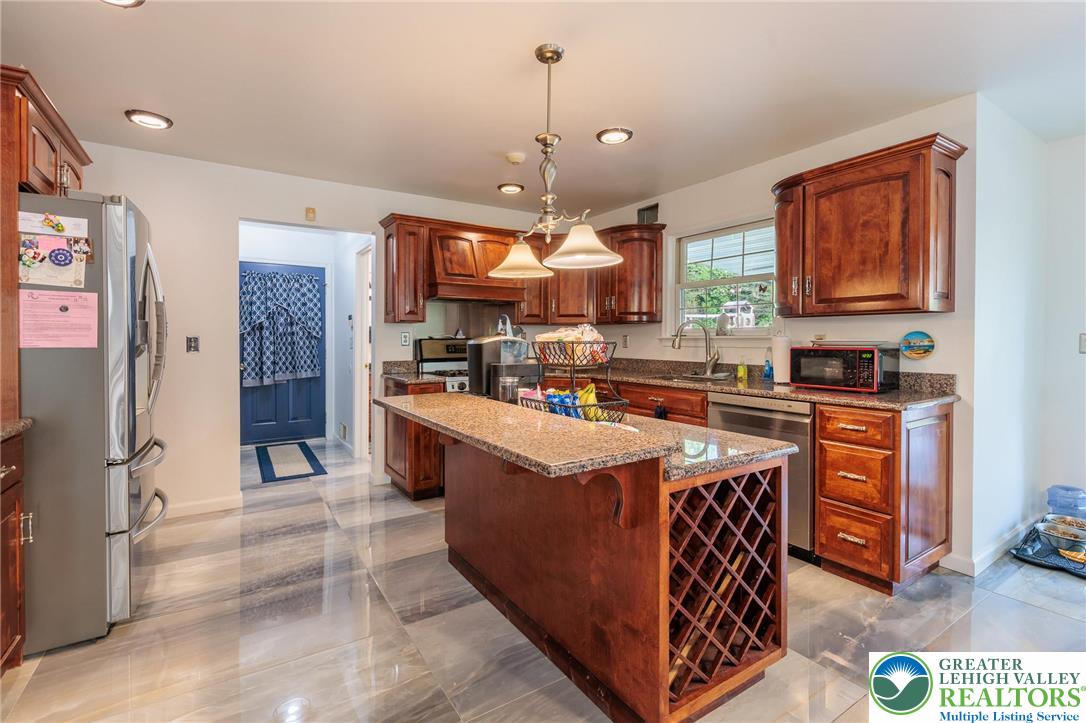 2170 Clearview Road Coplay, PA 18037 - Photo 24 of 75 This spacious kitchen offers granite counters, a kitchen island, and modern appliances.