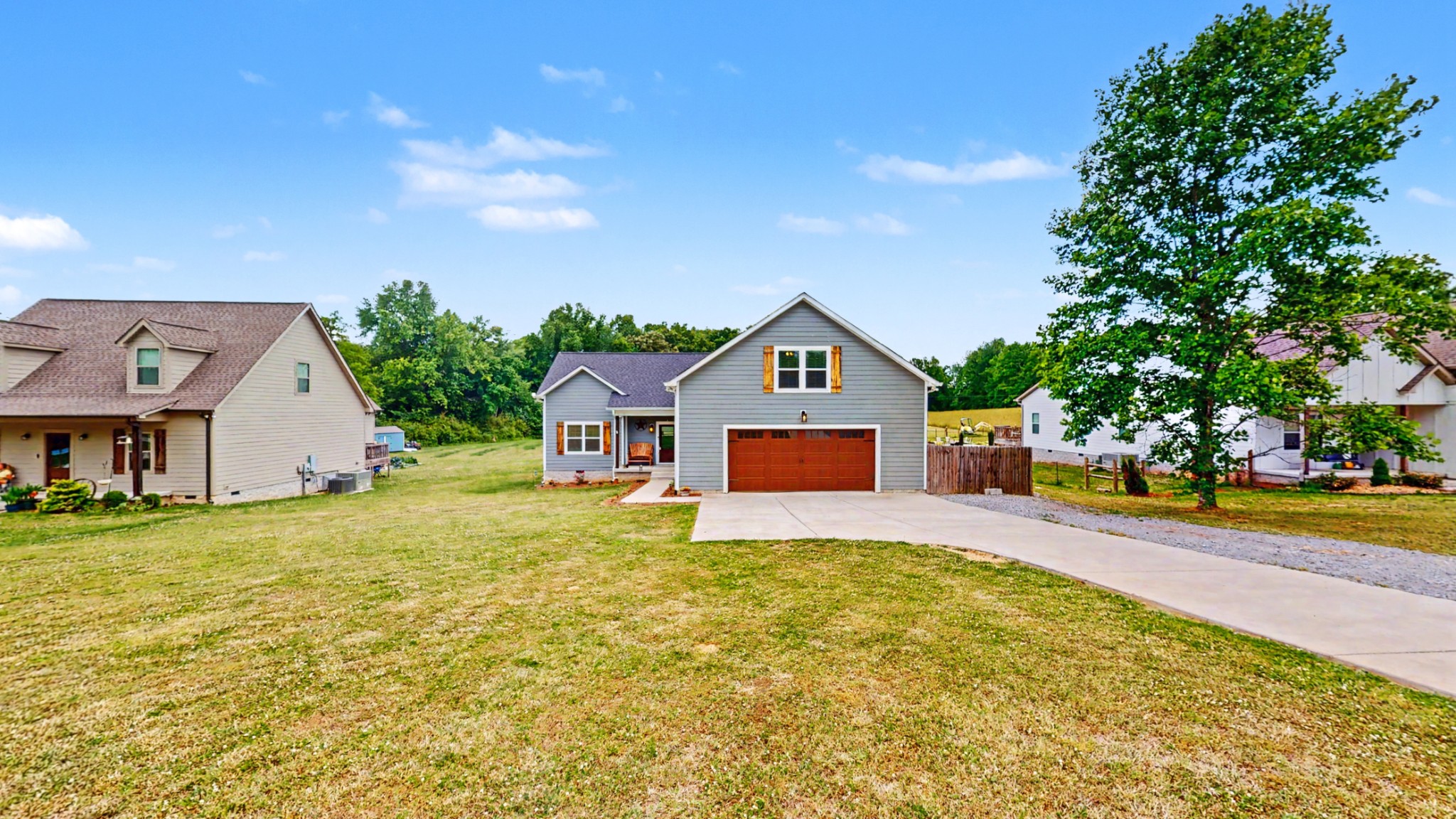 601 King Ridge Road Dowelltown, TN 37059 - Photo 2 of 49 a front view of a house with a yard and garage