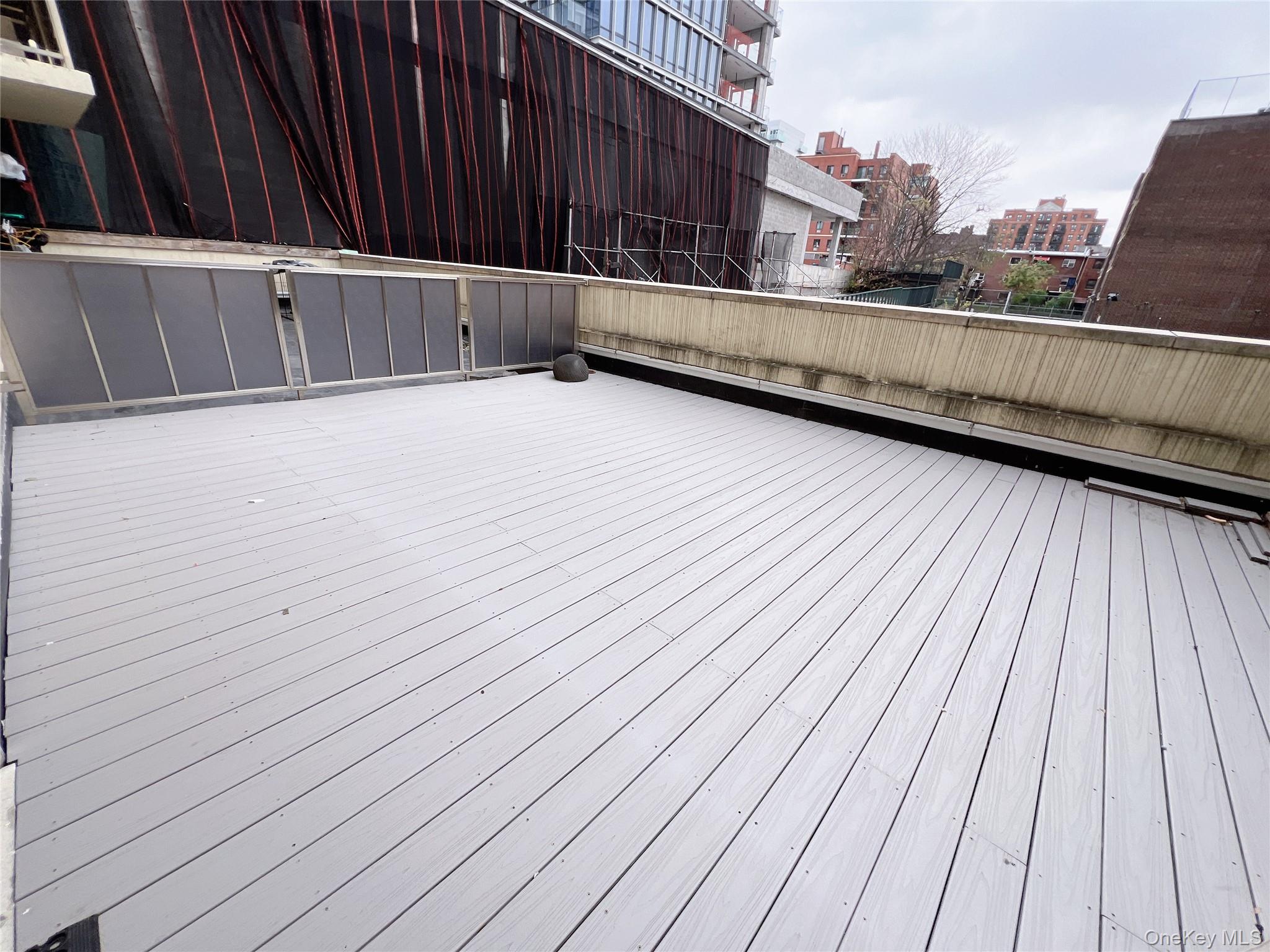 138-12 Northern Boulevard, Unit 3C Queens, NY 11354 - Photo 15 of 18 a view of a balcony with wooden floor