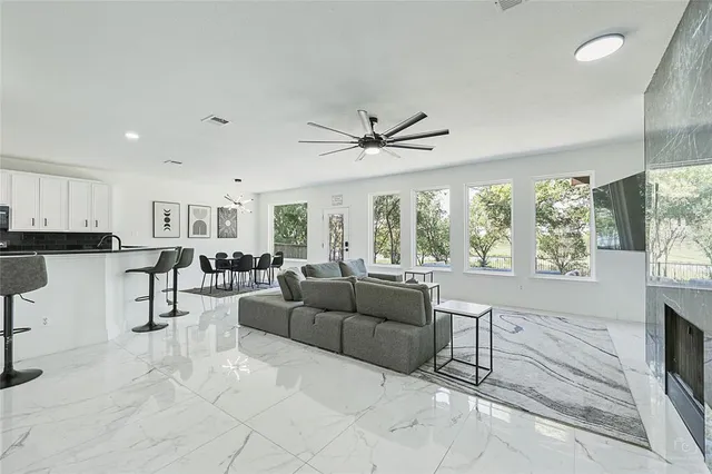 a living room with furniture and a large window