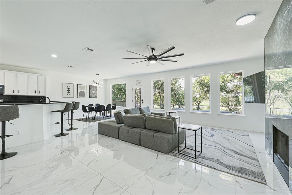3805 Overlook Court The Colony, TX 75056 - Photo 1 of 29 a living room with furniture and a large window