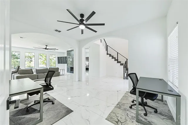 a dining room with furniture and window