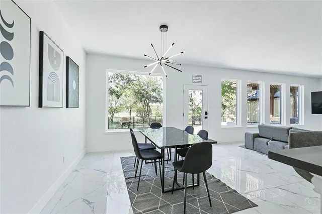 a spacious bedroom with a large bed and a large window