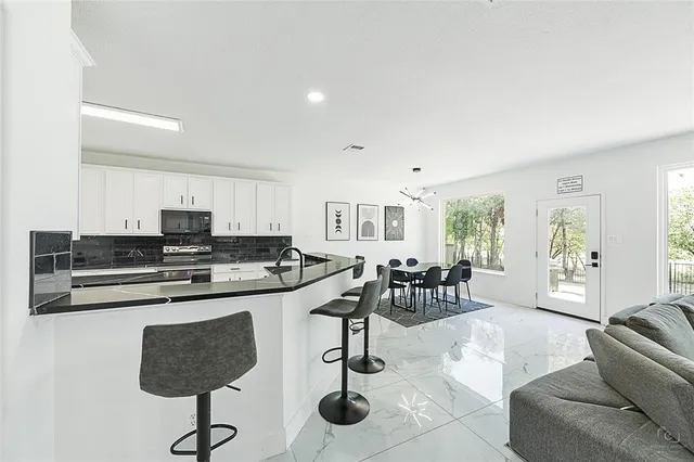 a bathroom with a bathtub and shower