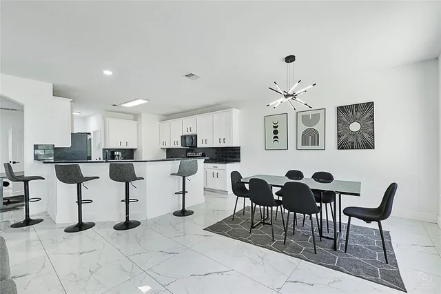 a view of a livingroom with furniture and a window