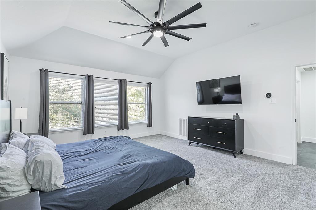 3805 Overlook Court The Colony, TX 75056 - Photo 5 of 29 a bedroom with a bed and a flat screen tv