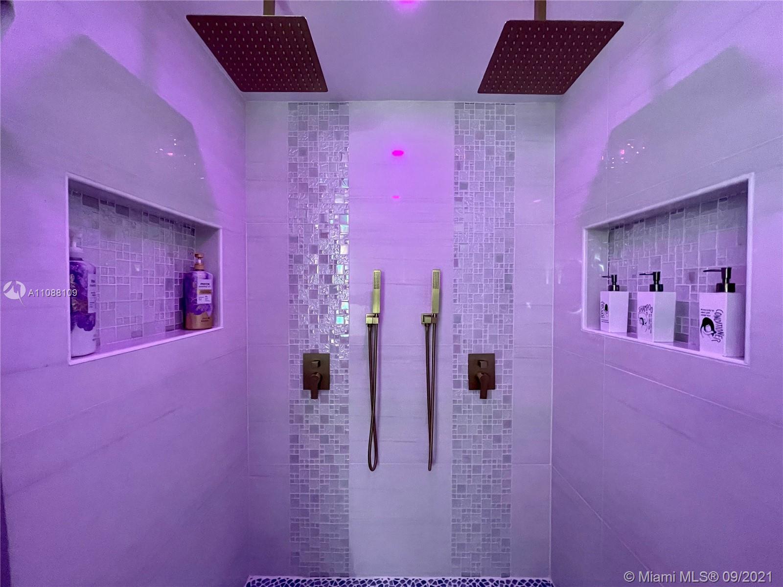 935 Euclid Avenue, Unit 5 Miami Beach, FL 33139 - Photo 19 of 27 a bathroom with a pink walls