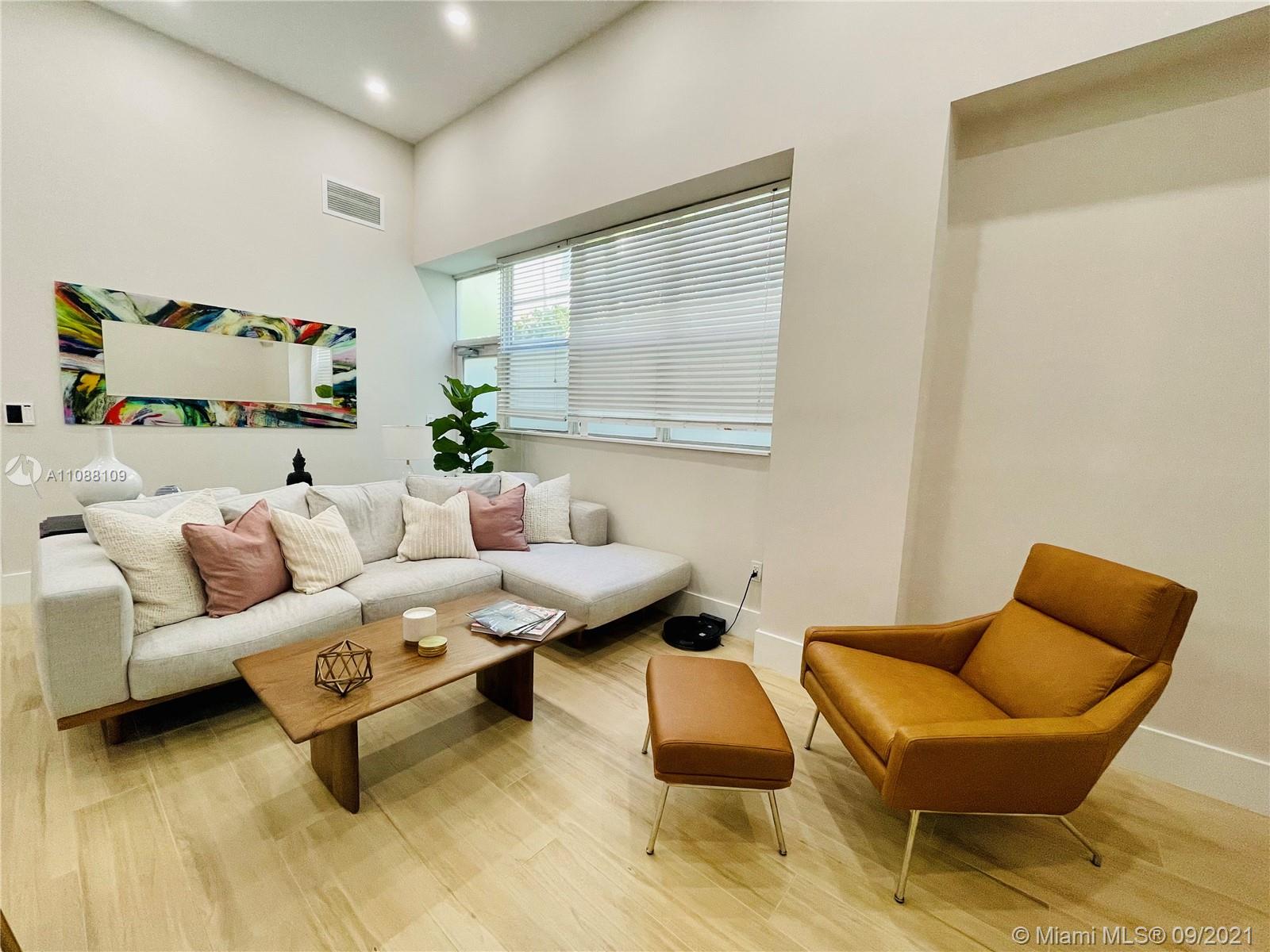 935 Euclid Avenue, Unit 5 Miami Beach, FL 33139 - Photo 8 of 27 a living room with furniture and a window