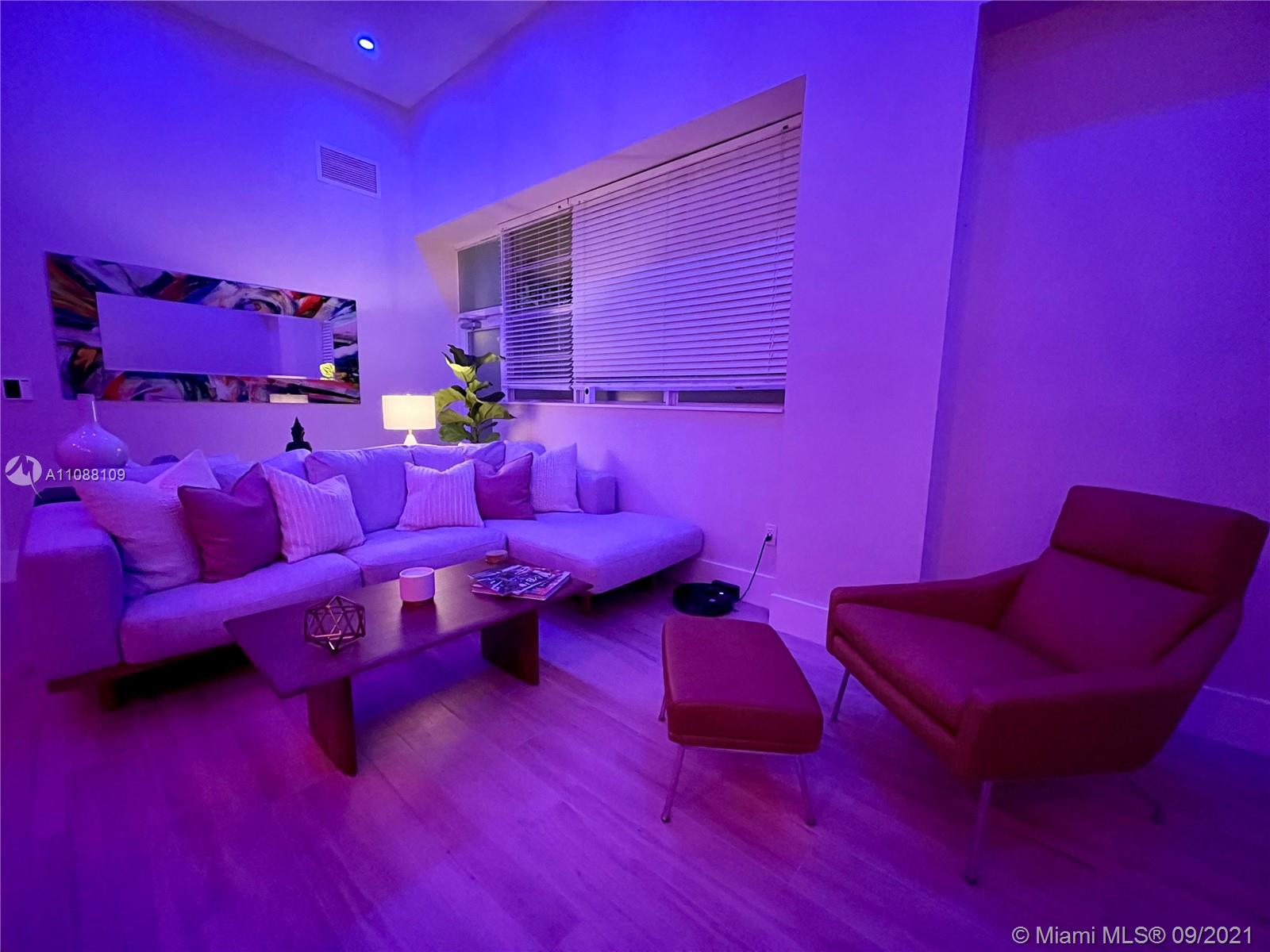 935 Euclid Avenue, Unit 5 Miami Beach, FL 33139 - Photo 9 of 27 a view of workspace with furniture and a couch